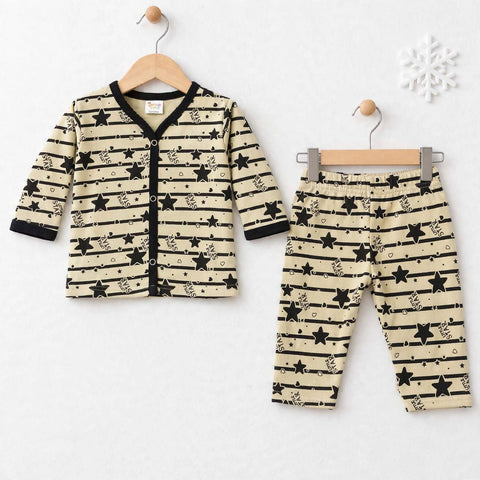 A baby two-piece outfit set consisting of a long-sleeve cardigan and matching pants, hanging on wooden hangers against a white background. The set features a beige base with black horizontal stripes, black star prints, and small decorative doodles.