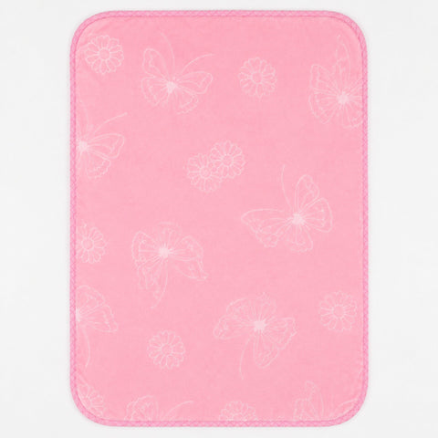A pink rectangular mat with rounded corners, featuring a subtle white outline pattern of butterflies and flowers, shown against a plain white background.
