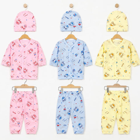 Three baby clothing sets displayed on wooden hangers against a white background, each set including a hat and matching top and pants. The sets are pink, light blue, and pale yellow, all featuring cartoon astronaut prints.