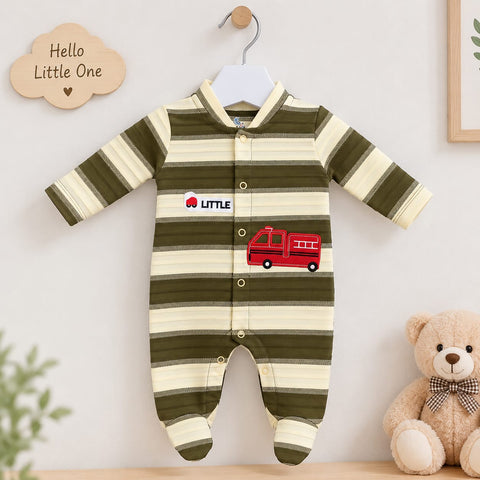 A baby long-sleeve footed sleeper with olive green and cream horizontal stripes, featuring a red fire truck graphic and a 'LITTLE' logo patch on the chest. The sleeper is displayed on a white hanger against a light wall, styled with a wooden 'Hello Little