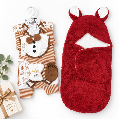 A baby gift set featuring a brown and white striped romper with a bib, a red plush hooded swaddle blanket with white ear tips, and a small cream welcome gift box on a white background.