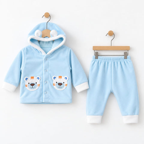 A baby two-piece clothing set consisting of a light blue hooded cardigan with embroidered tiger faces on the front and matching light blue pants with white cuffs, displayed on wooden hangers against a white background.