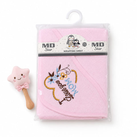 A folded light pink baby hooded towel in clear plastic packaging with a hanger, next to a small pink star-shaped baby rattle on a white background.