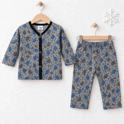 A two-piece baby clothing set consisting of a long-sleeve cardigan and matching pants, displayed on wooden hangers against a white textured background. The set features a gray base with blue and black spotted patterns, a black trim on the cardigan's colla