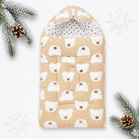 A quilted baby blanket or sleeping bag with a hood, featuring a repeating pattern of white polar bear faces on a beige corduroy background. The inside lining is white with small multicolored polka dots.