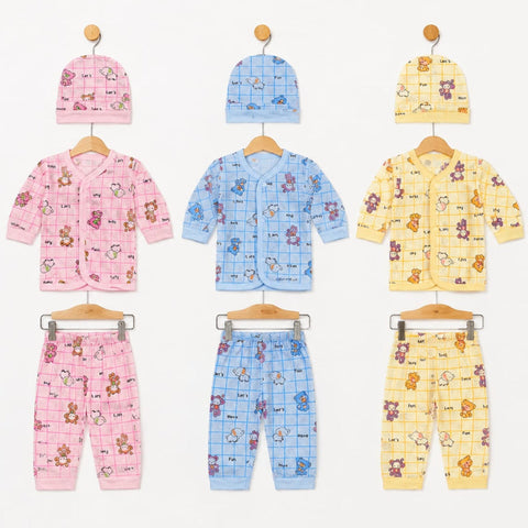 Six baby clothing sets displayed on wooden hangers against a white background, including three pink, three blue, and three yellow outfits with matching hats. Each set features a grid pattern with cartoon teddy bears and animals.
