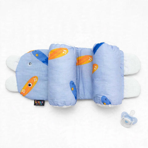 A blue caterpillar-themed baby support pillow with orange and yellow details, shown on a white background next to a pacifier.