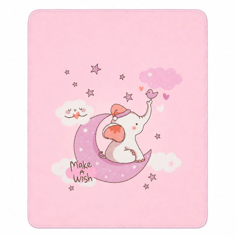 A square pink blanket or throw featuring a cute cartoon illustration of a white elephant sitting on a pink crescent moon, surrounded by stars, clouds, and hearts, with the words 'Make a Wish' printed near the bottom left.