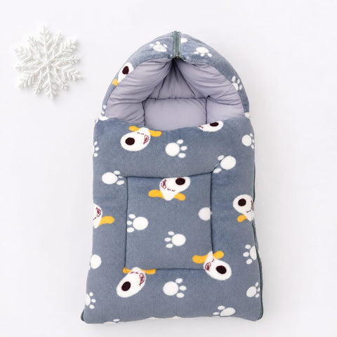 A gray pet fleece bootie with a cartoon dog and paw print pattern, shown on a white background with a decorative white snowflake in the corner.