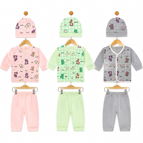 Three baby clothing sets displayed on wooden hangers against a white background, each including a long-sleeve top and pants in soft pastel colors with cartoon animal prints and grid patterns. The sets are pink, mint green, and light gray.
