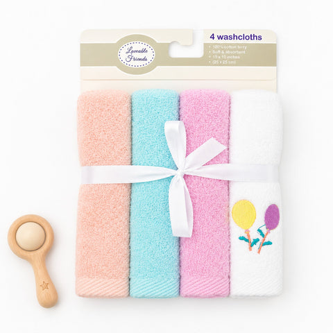 Four folded washcloths in pastel peach, aqua, pink, and white, tied with a white ribbon and displayed on a white background with a small wooden toy spoon. The package header reads 'Lovely Friends 4 washcloths'.